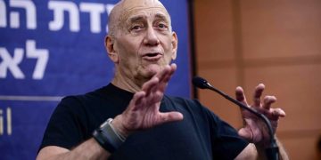 Last week, former Israeli Prime Minister Ehud Olmert, seen here at a March 2023 demonstration in Tel Aviv, wrote an op-ed condemning his country for committing "war crimes".